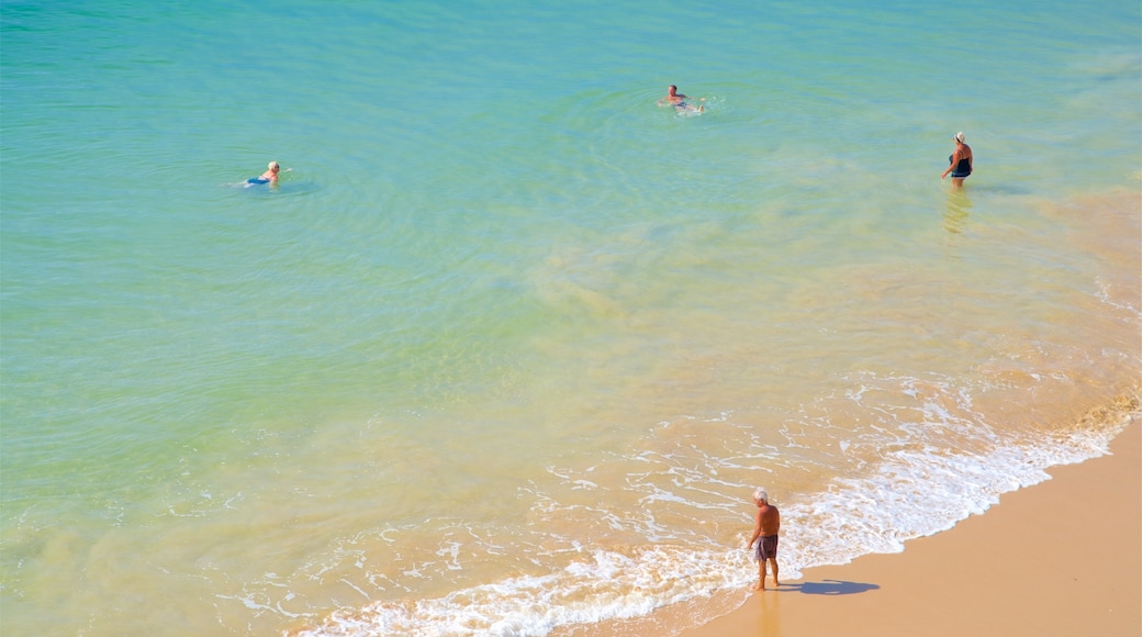 Olhos D\'Agua Beach which includes a sandy beach, swimming and general coastal views