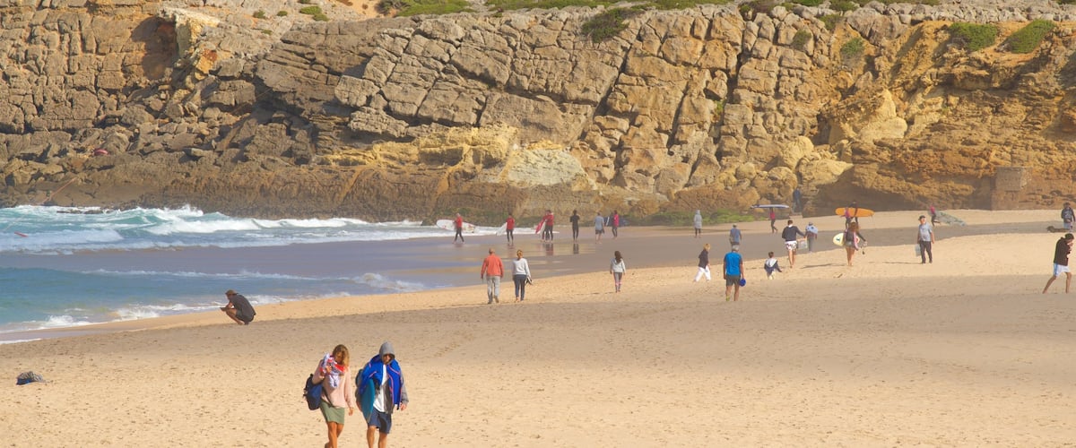 Guincho Beach which includes rocky coastline, general coastal views and a beach