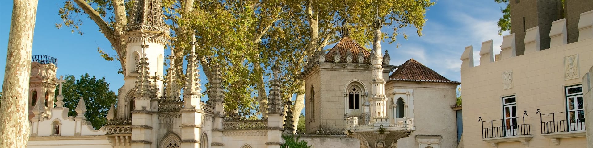 Portugal dos Pequenitos which includes a square or plaza and a fountain