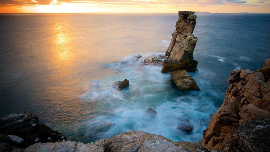 Cabo Carvoeiro which includes rugged coastline, a sunset and general coastal views