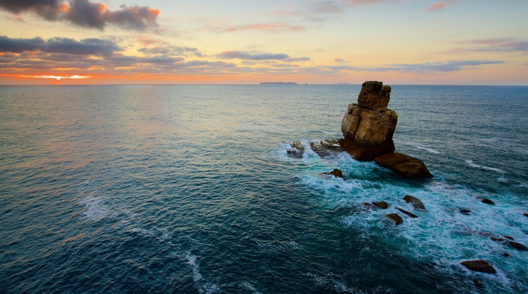 Cabo Carvoeiro which includes a sunset, rocky coastline and general coastal views