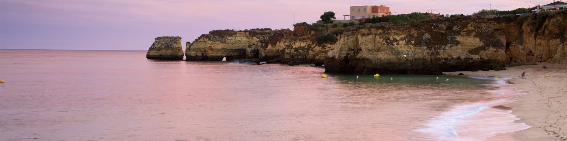 Batata Beach showing a sunset, rugged coastline and general coastal views