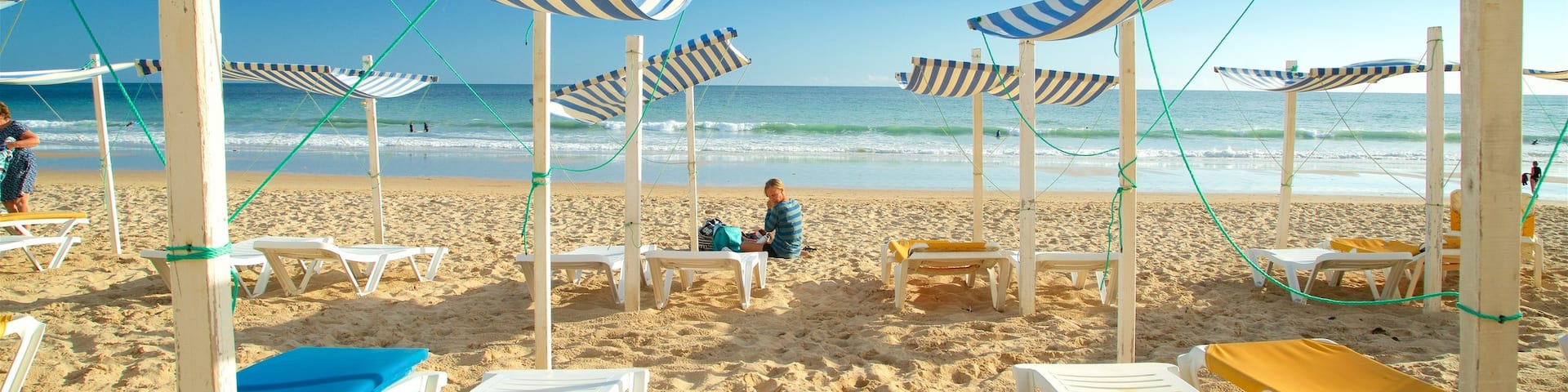 Porto de Mos Beach featuring a beach and general coastal views as well as an individual femail