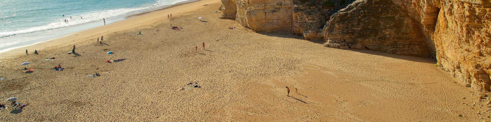 Beliche Beach which includes general coastal views, rocky coastline and a sandy beach