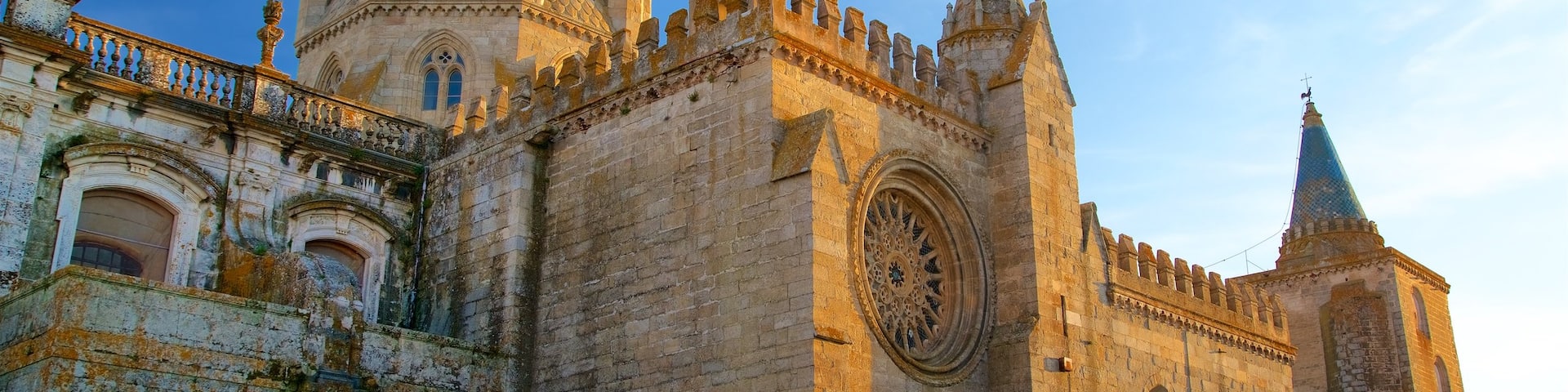 Evora Cathedral featuring a sunset, heritage architecture and a church or cathedral