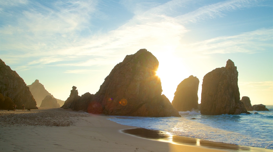 Ursa Beach which includes a sandy beach, rocky coastline and general coastal views