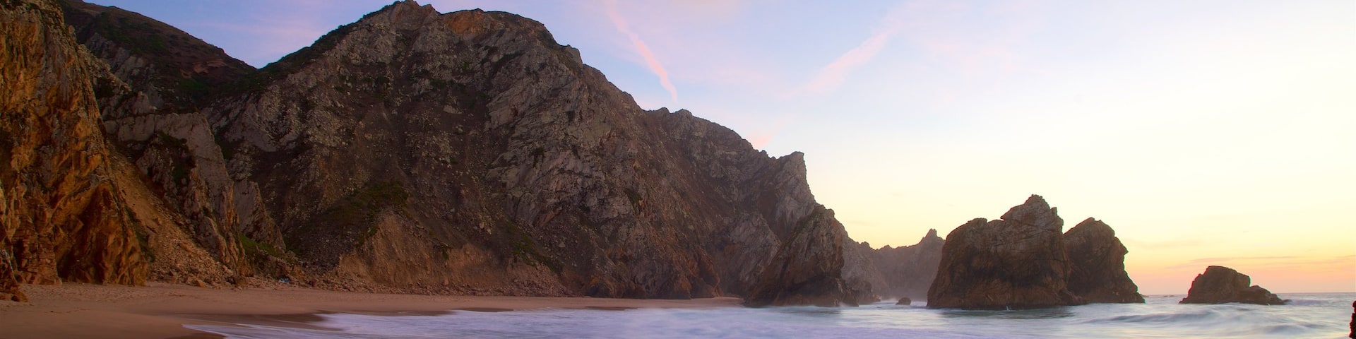 Ursa Beach which includes a sandy beach, general coastal views and a sunset