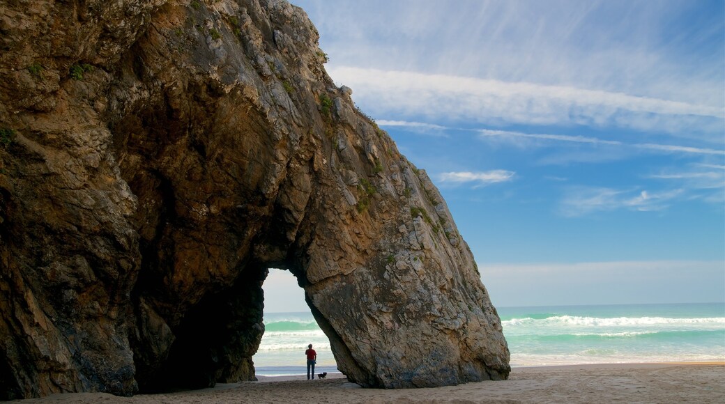 Adraga Beach featuring general coastal views, rocky coastline and a sandy beach