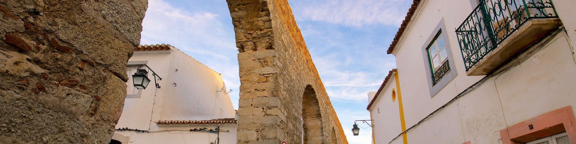Aqueduto da Água de Prata featuring heritage elements as well as a small group of people