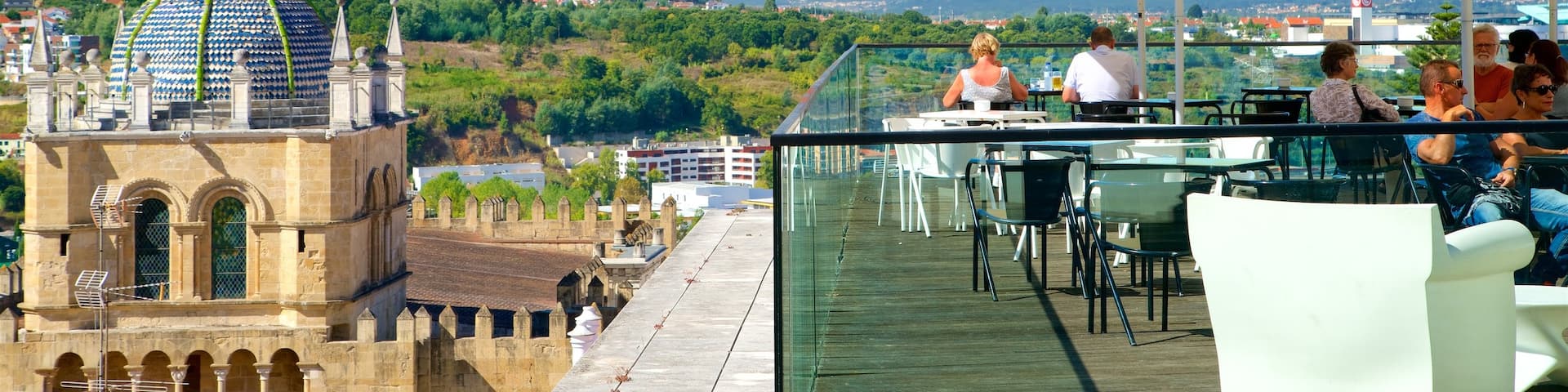 Coimbra showing heritage elements and outdoor eating as well as a small group of people