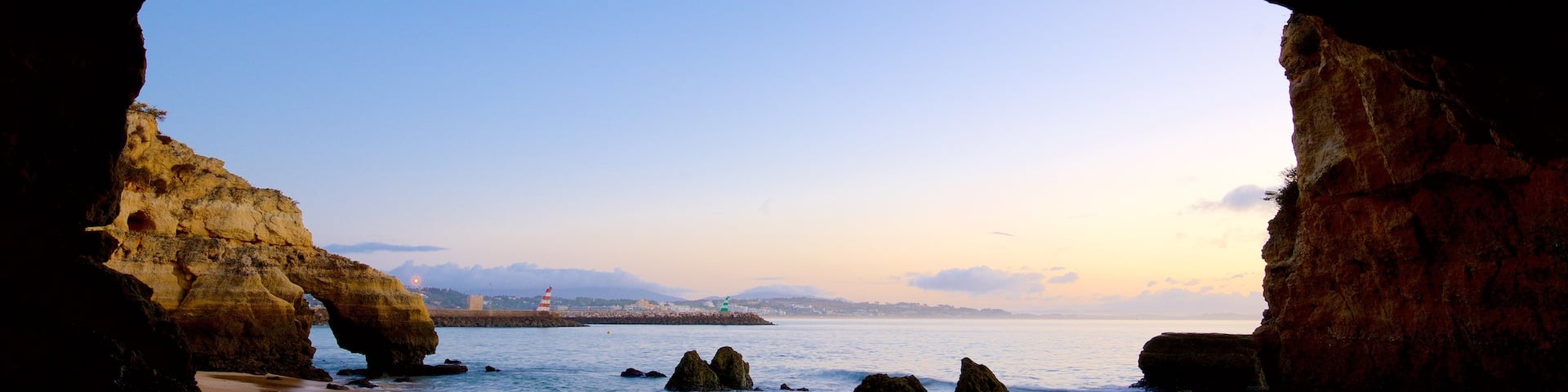 Lagos featuring a sunset, general coastal views and rocky coastline