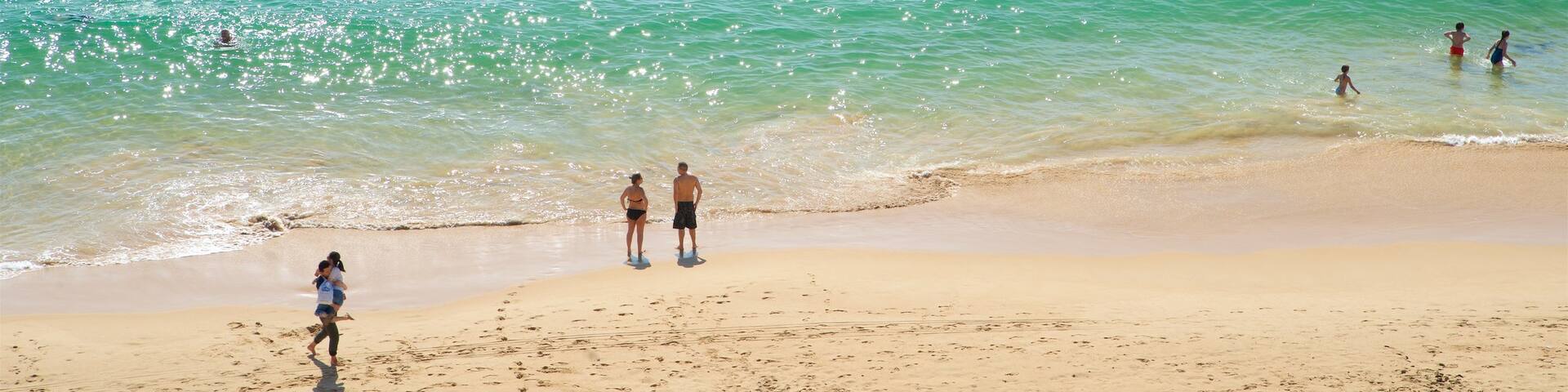 Portimao featuring swimming, a beach and general coastal views