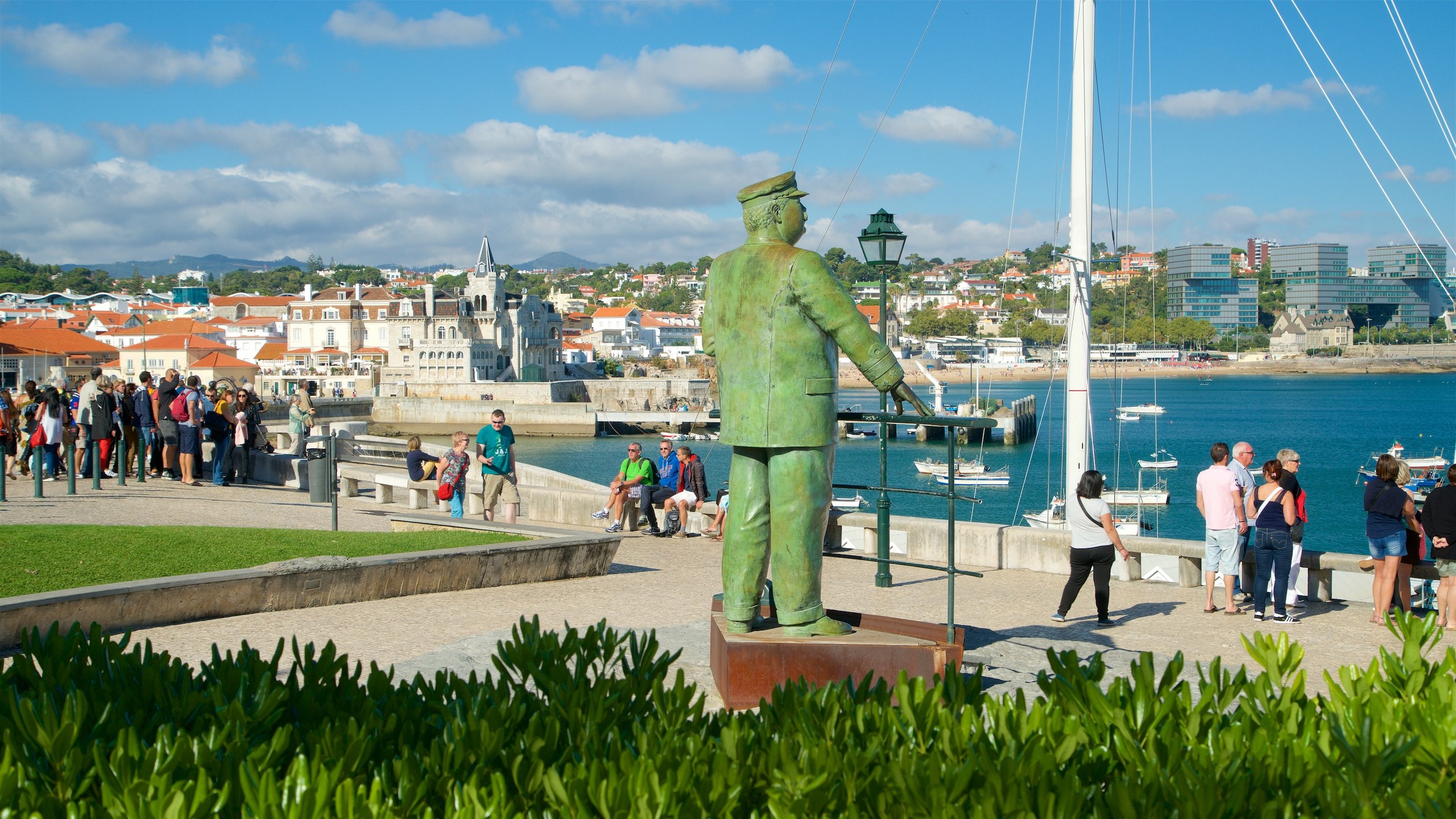 Cascais which includes views, a coastal town and a statue or sculpture