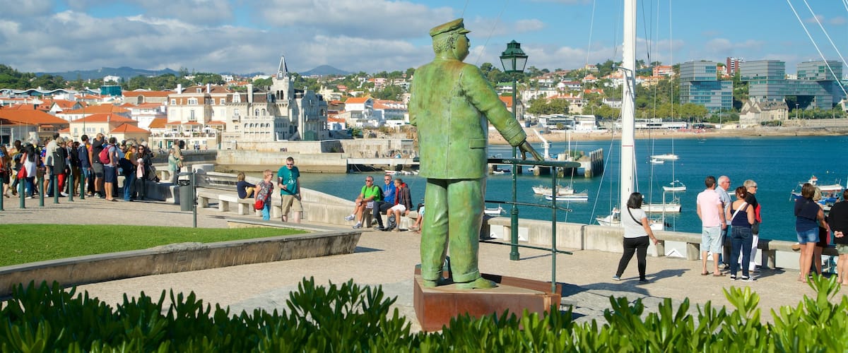 Cascais which includes views, a coastal town and a statue or sculpture
