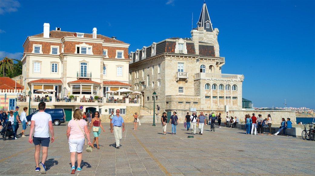 Cascais showing a square or plaza as well as a small group of people