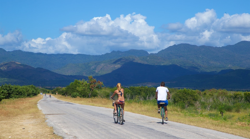 Ancon Beach featuring road cycling and tranquil scenes as well as a couple