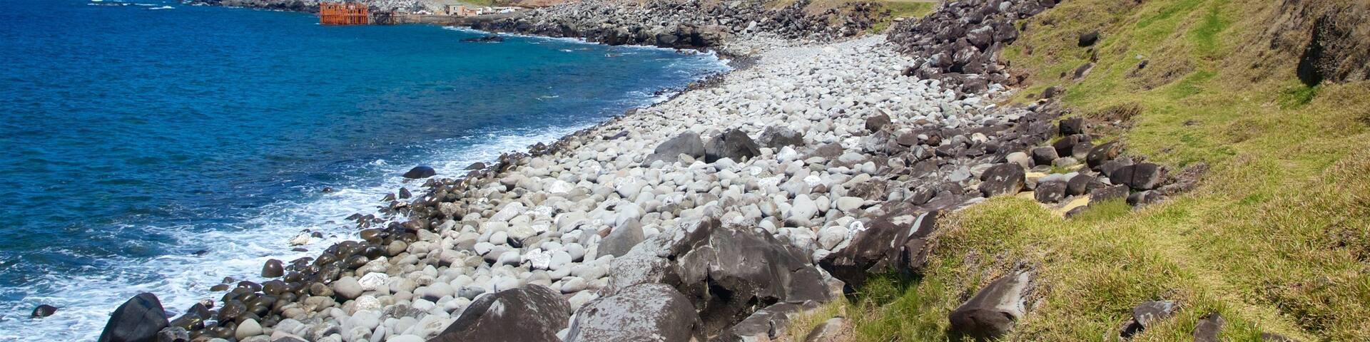 Norfolk-Insel welches beinhaltet Steinstrand, allgemeine Küstenansicht und schroffe Küste