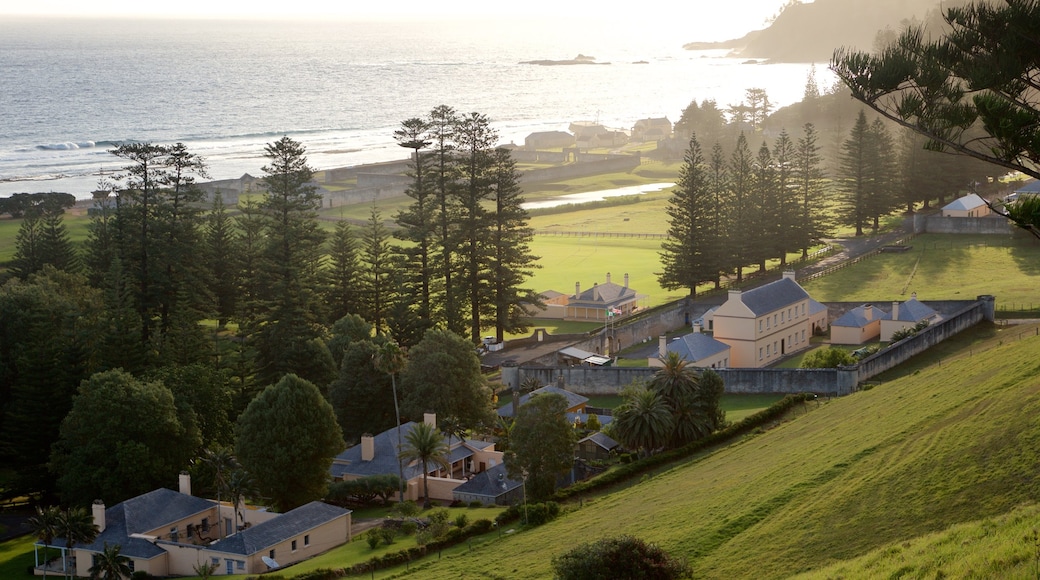 Norfolk Island featuring a sunset, a small town or village and general coastal views