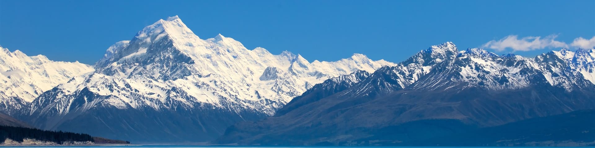 Lake Pukaki featuring snow, mountains and a lake or waterhole