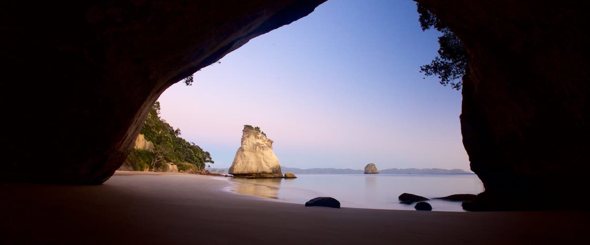 Cathedral Cove Beach which includes a sunset, a beach and general coastal views