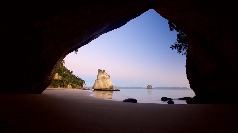 Cathedral Cove Beach featuring a sunset, general coastal views and caves