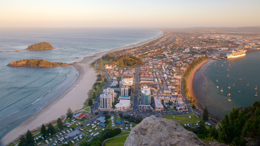 Mount Maunganui showing a sandy beach, general coastal views and a city