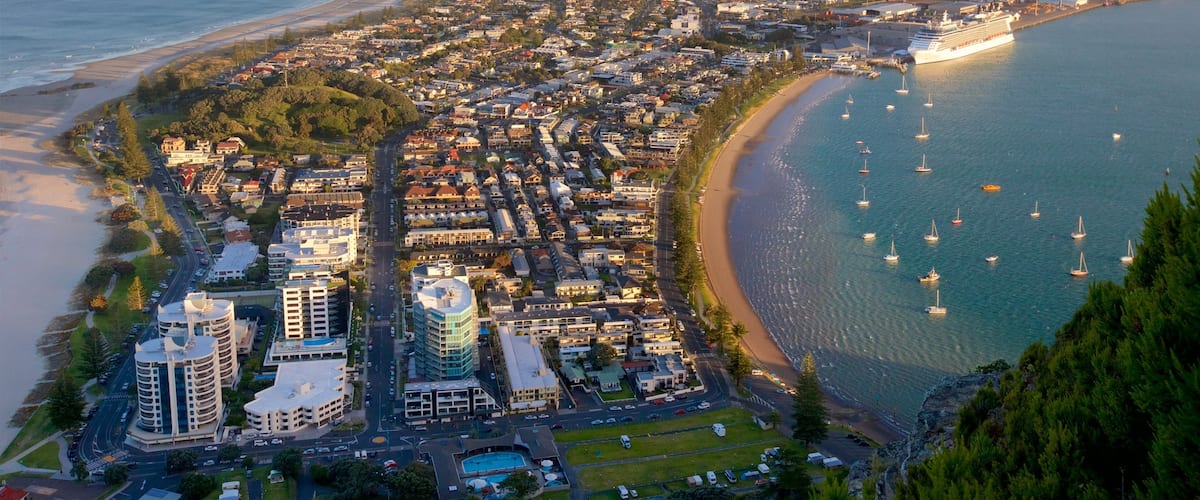 Mount Maunganui showing a coastal town, a bay or harbor and general coastal views