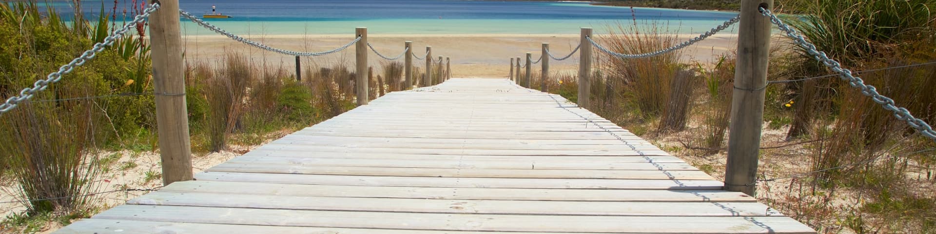 Kai Iwi Lakes showing a bay or harbor and a sandy beach