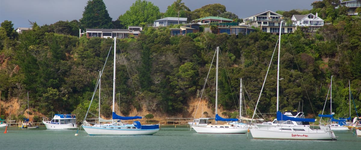 Okiato featuring a bay or harbor and a small town or village