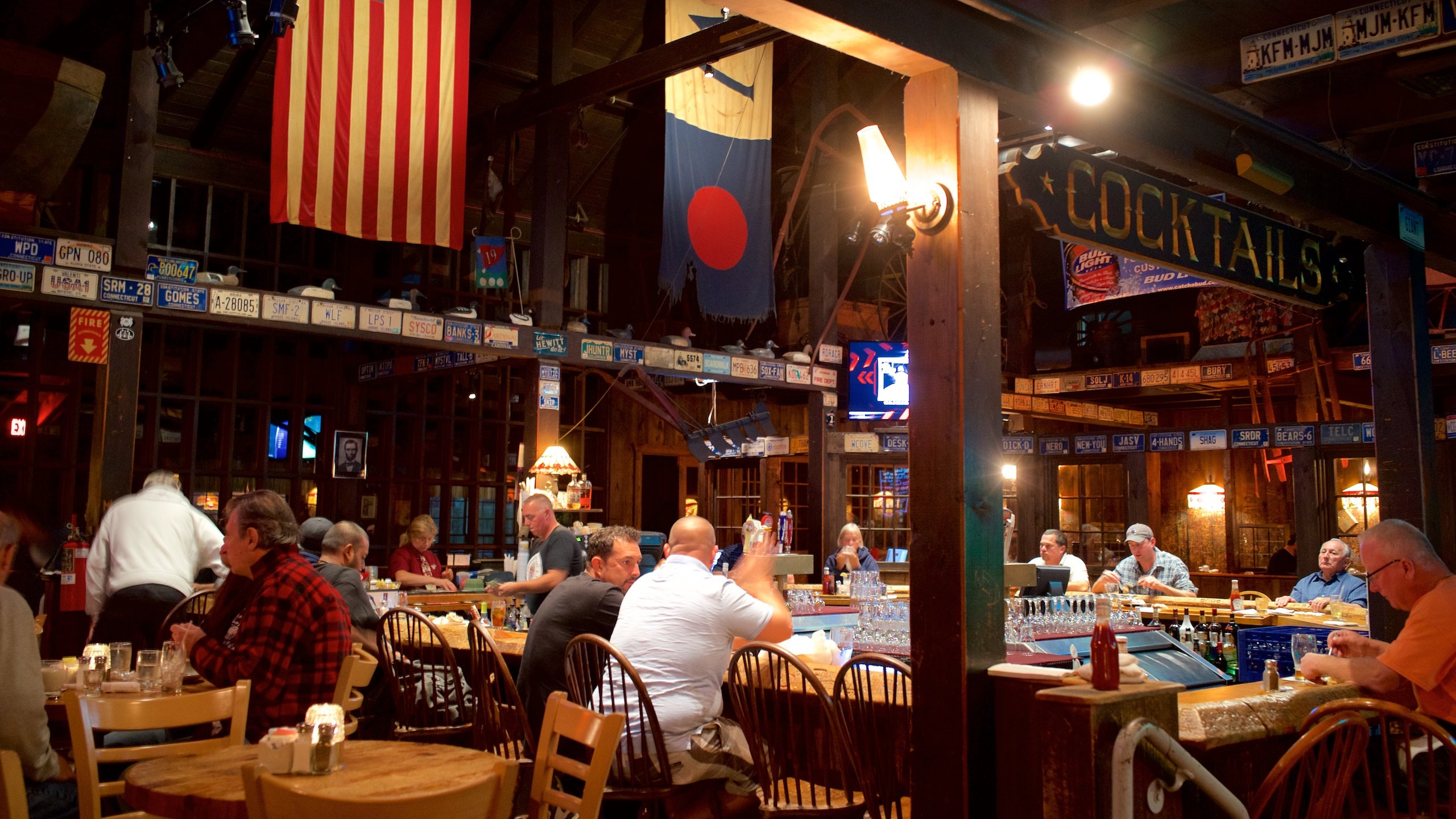 Mystic featuring dining out and interior views as well as a small group of people