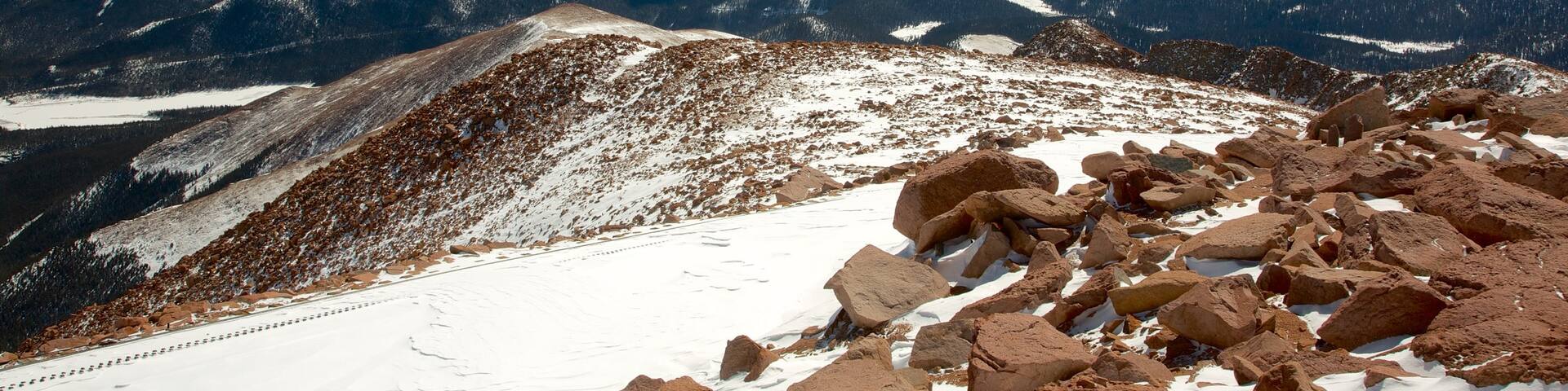 Pikes Peak which includes mountains, snow and landscape views