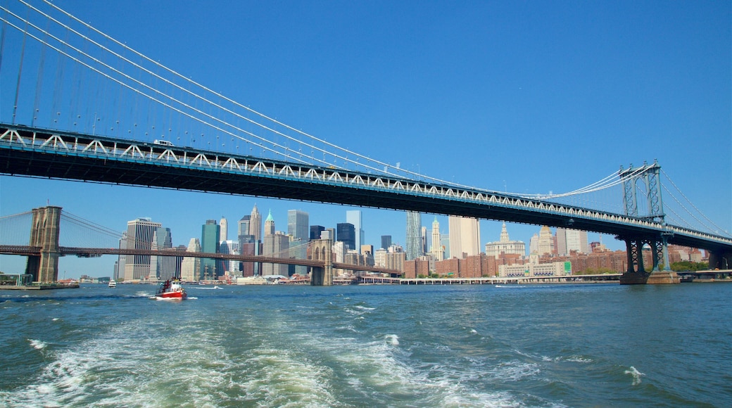 Manhattan Bridge featuring a bridge, a city and boating