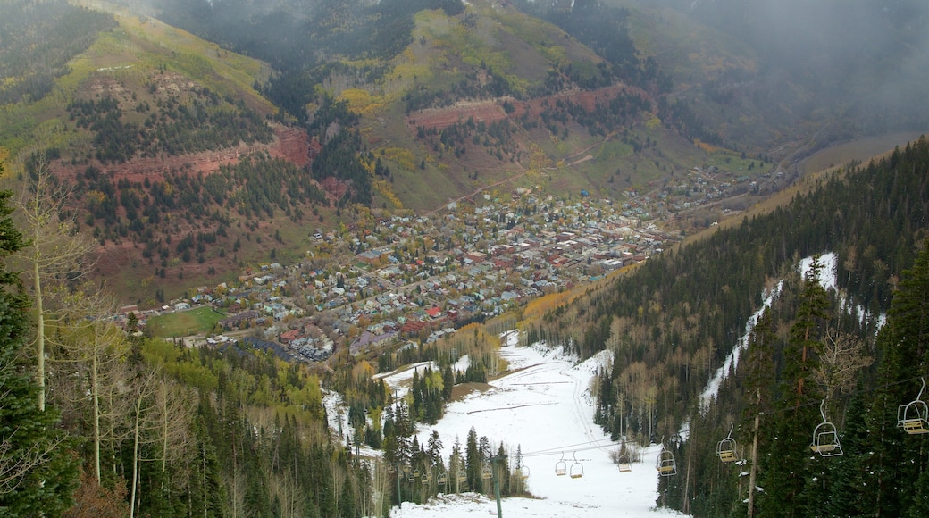 Telluride Ski Area showing a gorge or canyon, a small town or village and snow