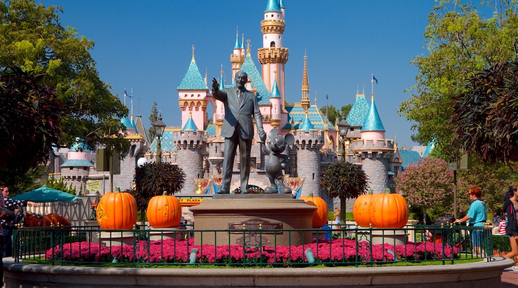 Disneyland® Park which includes rides, flowers and a statue or sculpture