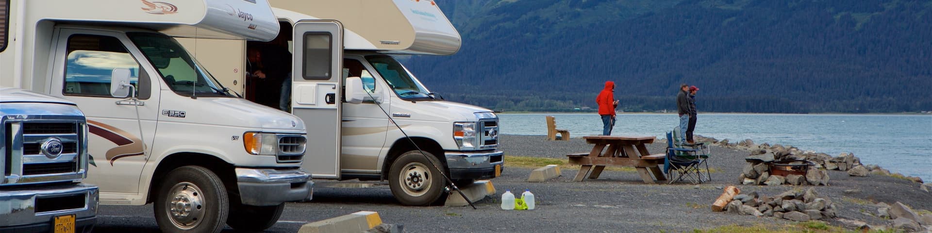 Seward featuring camping and a lake or waterhole as well as a small group of people