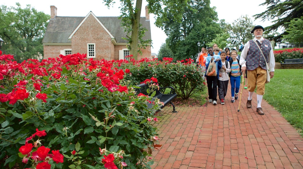 Maryland State House showing wildflowers and a garden as well as children