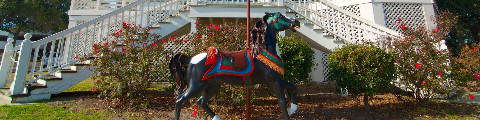Exploring the Art Museum of Myrtle Beach with its charming architecture and carousel horse statue
