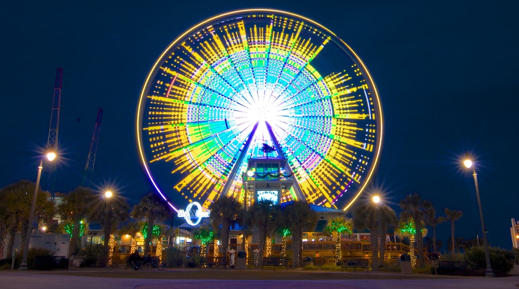 SkyWheel Myrtle Beach featuring rides and night scenes