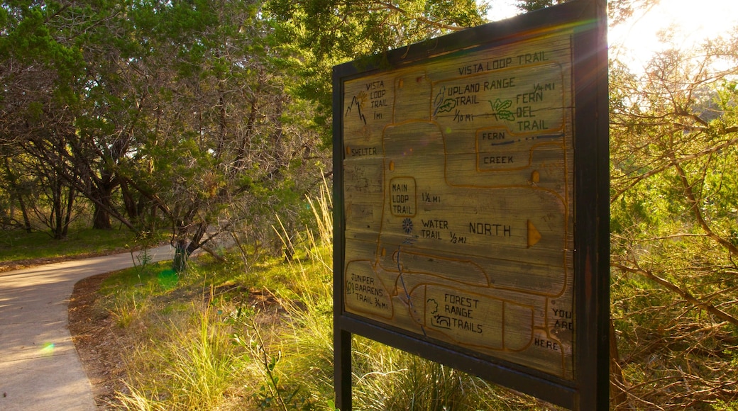 Friedrich Wilderness Park which includes tranquil scenes, a garden and signage