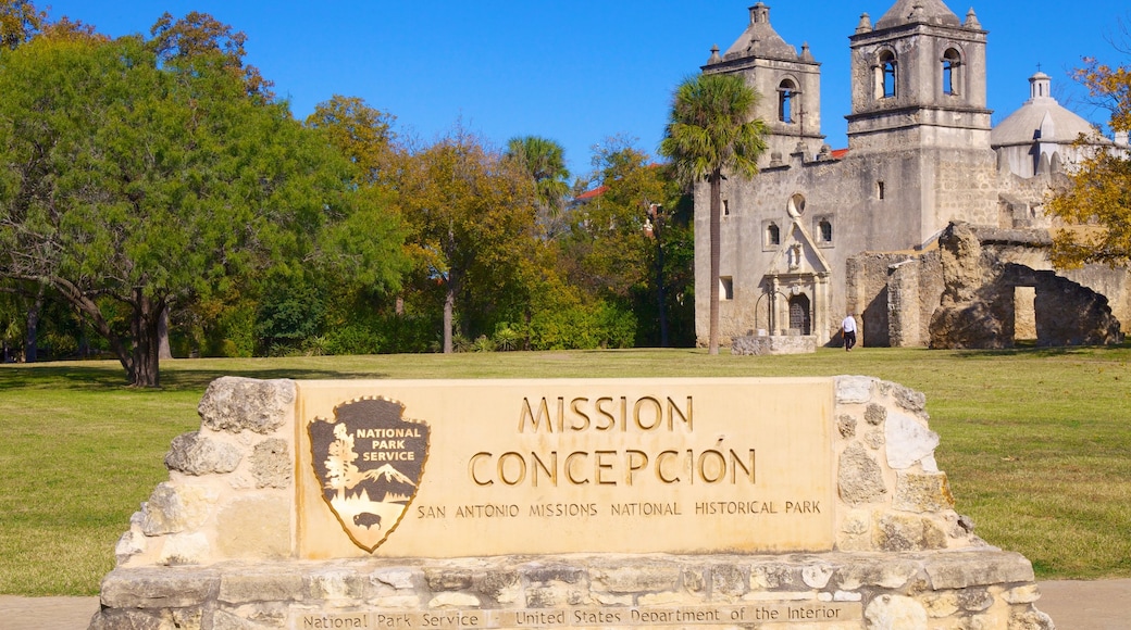 San Antonio Missions National Park featuring signage, a park and a castle