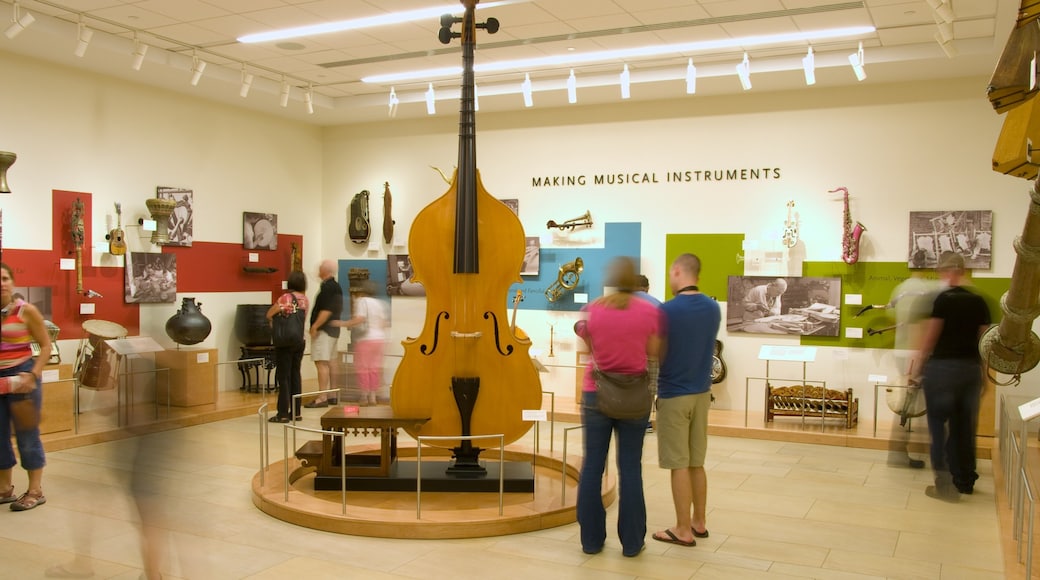 Musical Instrument Museum featuring interior views as well as a small group of people