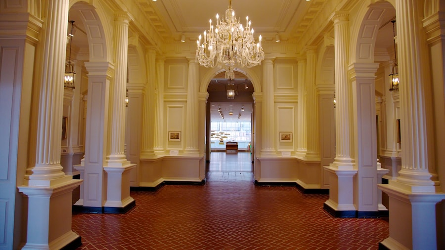 Elegant interior of the Chicago History Museum with chandeliers and columns.
