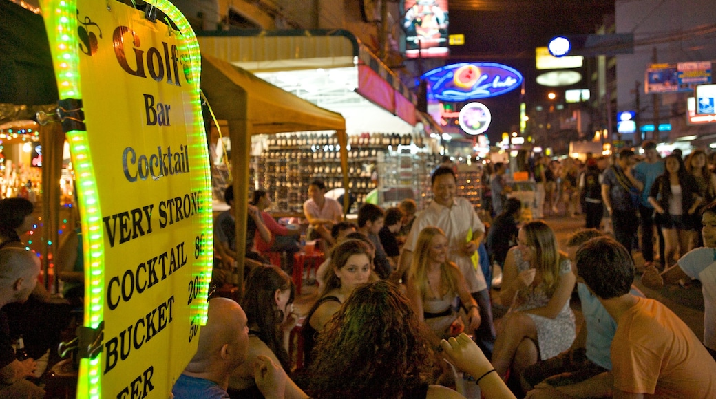 Khao San Road featuring signage, night scenes and a bar