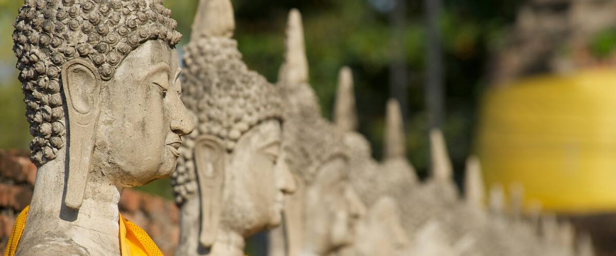 Ayutthaya which includes a temple or place of worship and a monument