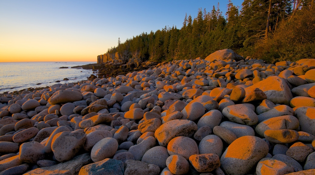 Otter Cliff featuring general coastal views, a pebble beach and a sunset