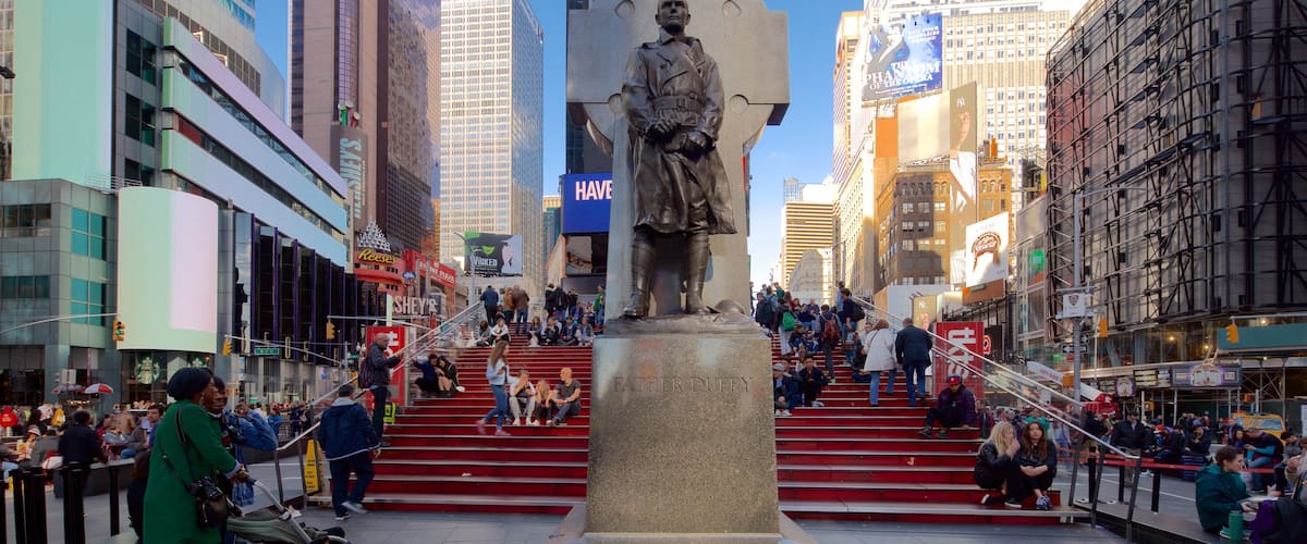 Times Square featuring a statue or sculpture, a city and cbd
