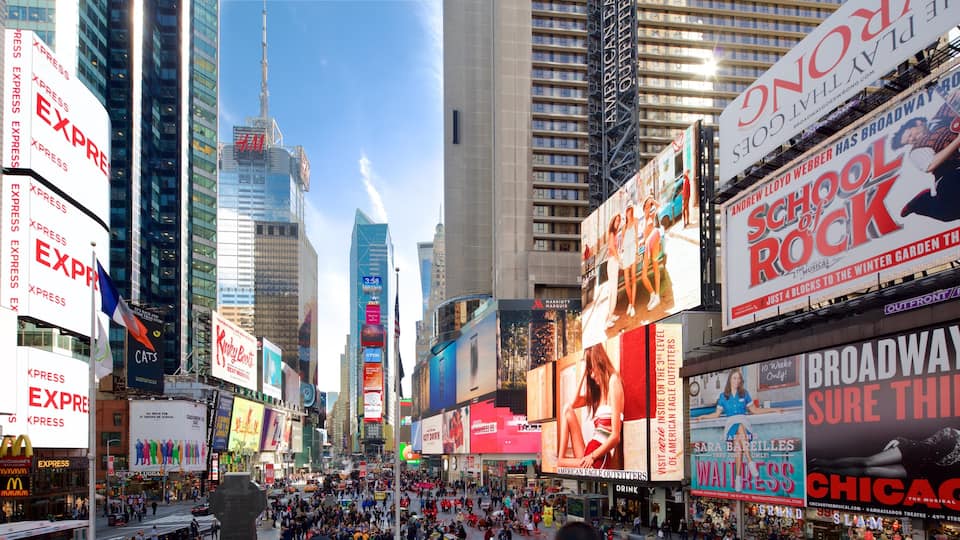 Times Square featuring signage, a high-rise building and a city
