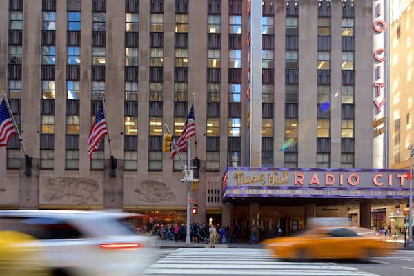 Radio City Music Hall featuring signage and a city