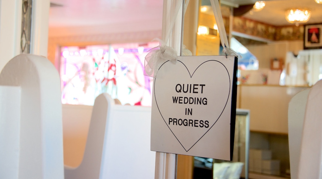 Little White Wedding Chapel showing interior views and signage