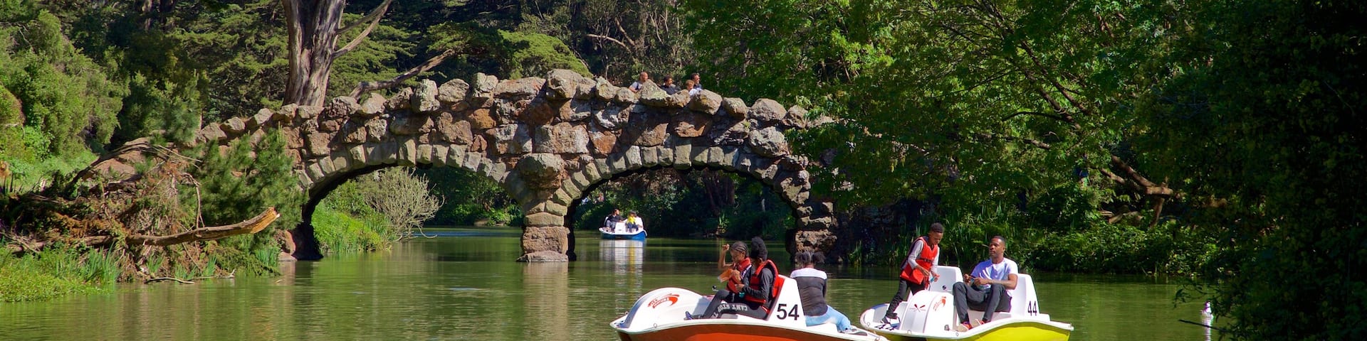 Stow Lake showing boating, a bridge and a river or creek